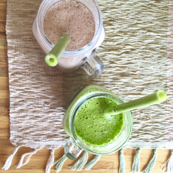 a bowl of soup and a spoon on a table