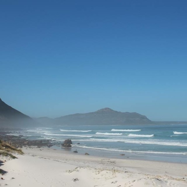 a beach with a mountain in the background
