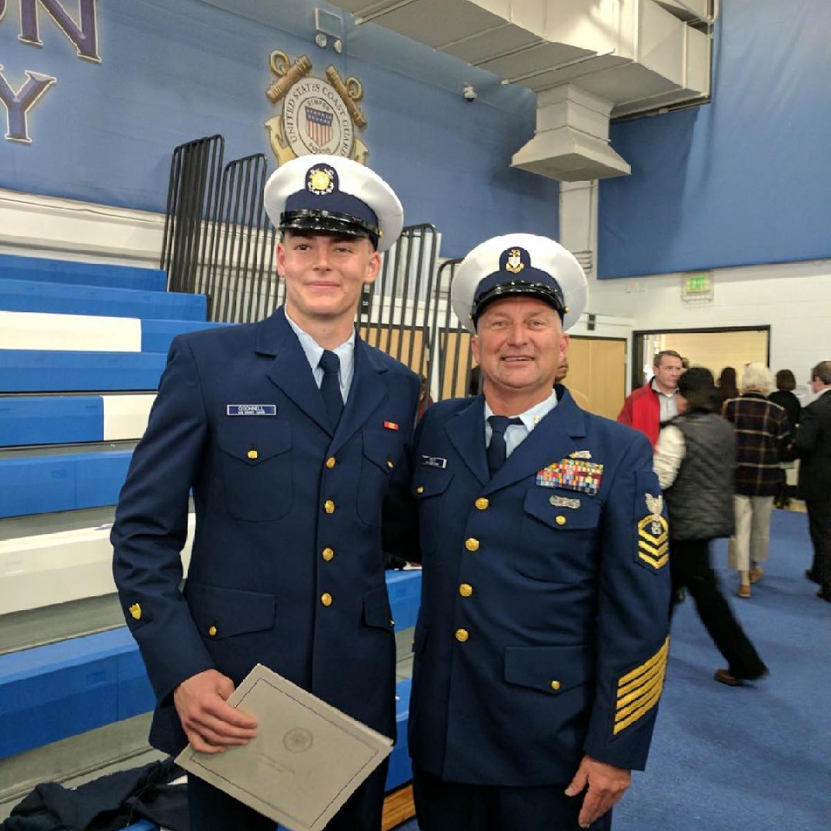 a group of people standing in front of a military uniform