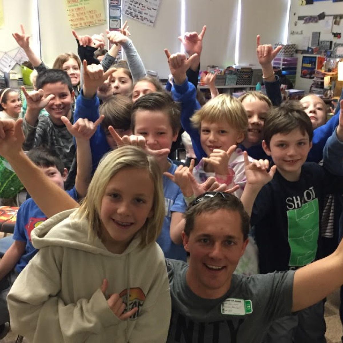 a young child standing in front of a crowd