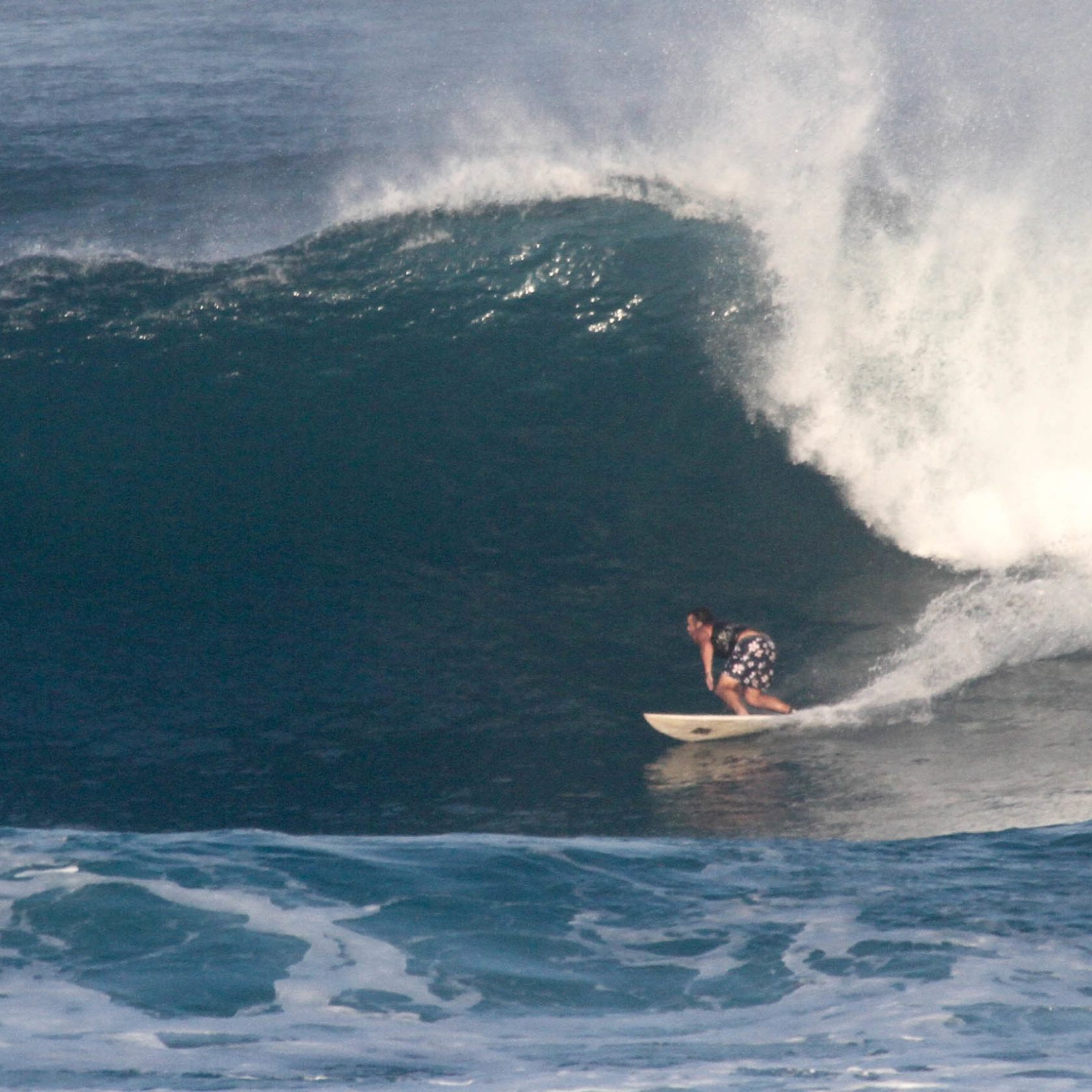 a man riding a wave in the ocean