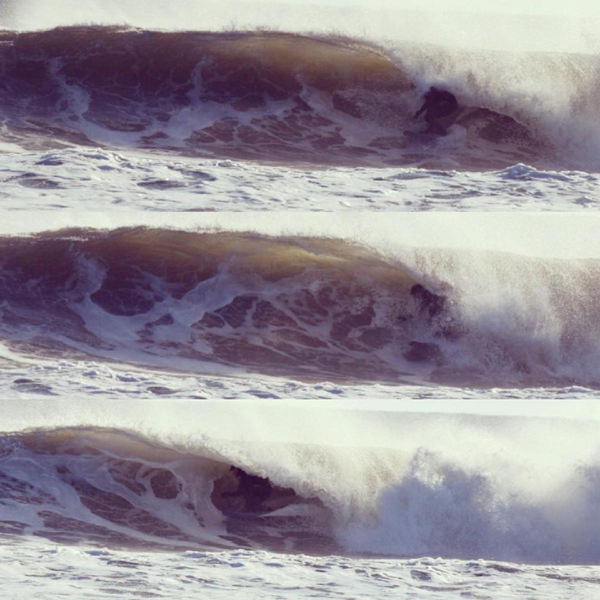 a person riding a wave on a surfboard in the ocean