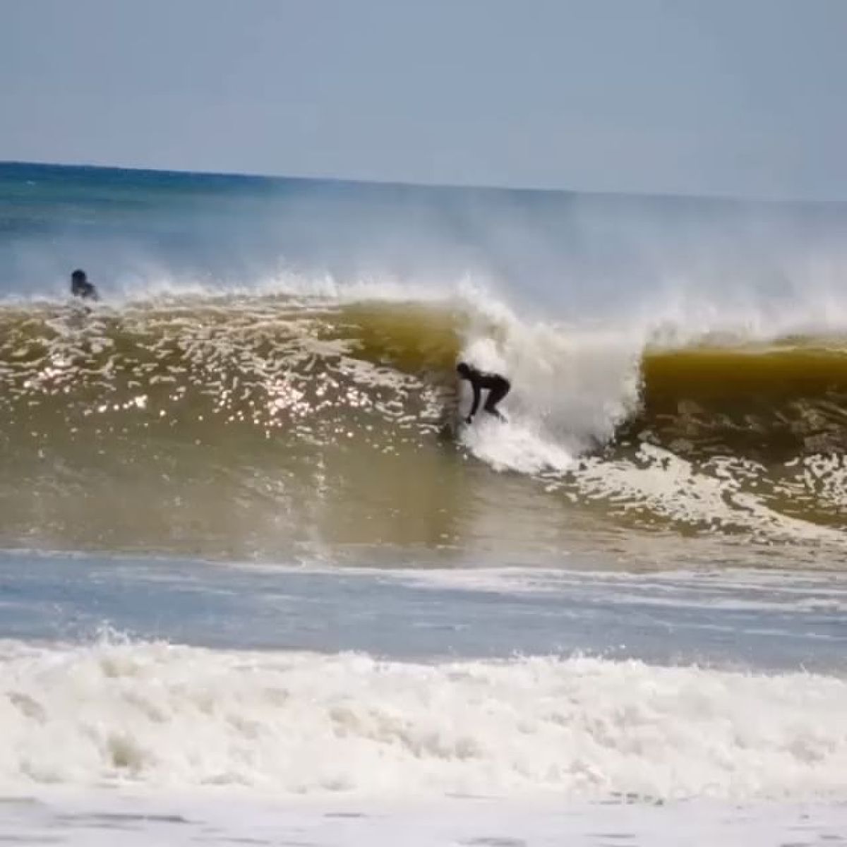 a man riding a wave in the ocean