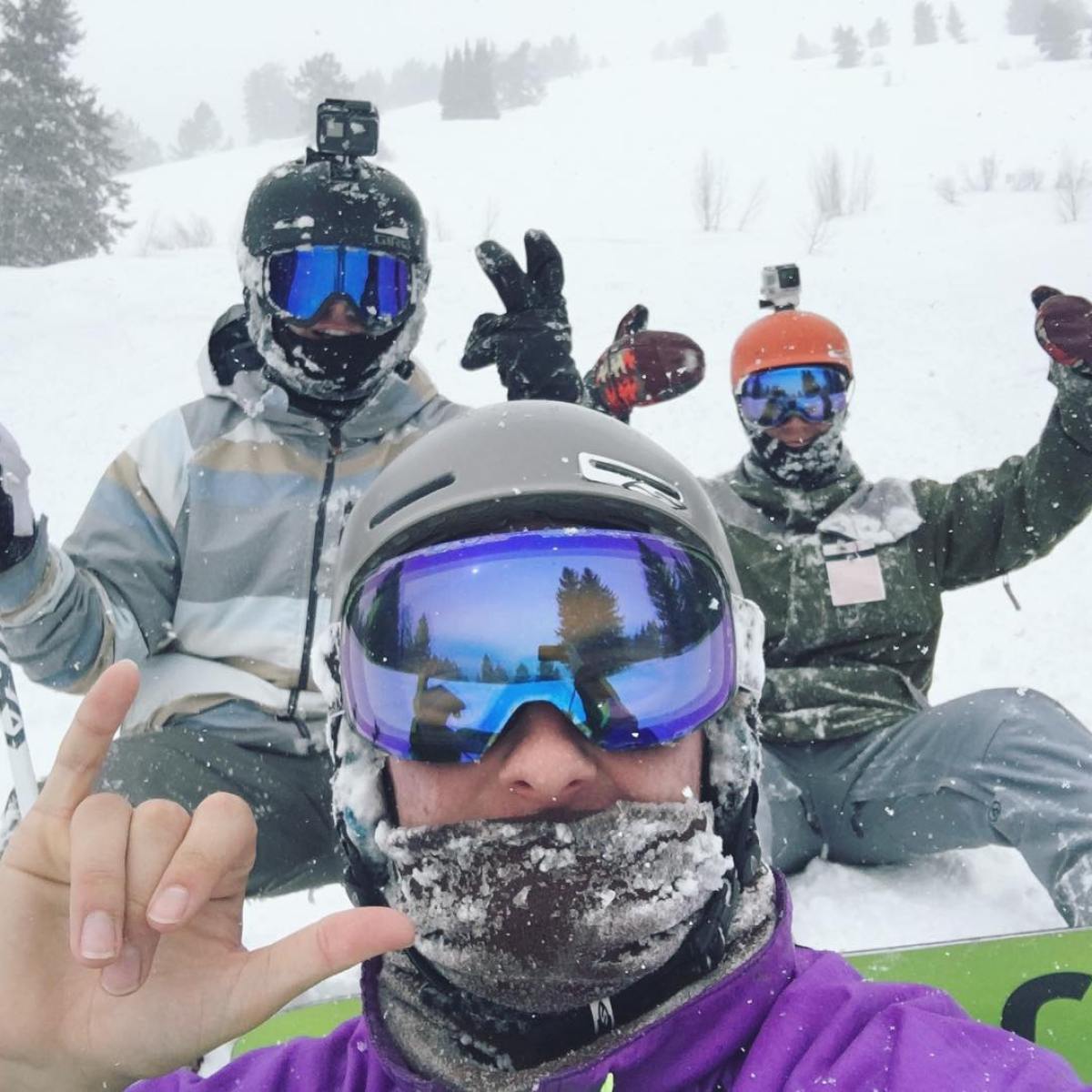 a group of people that are standing in the snow