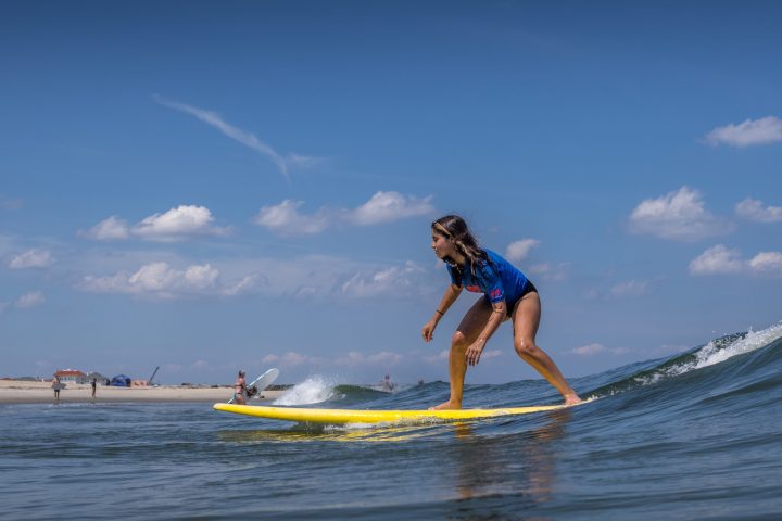 a man riding a wave on a surfboard in the water