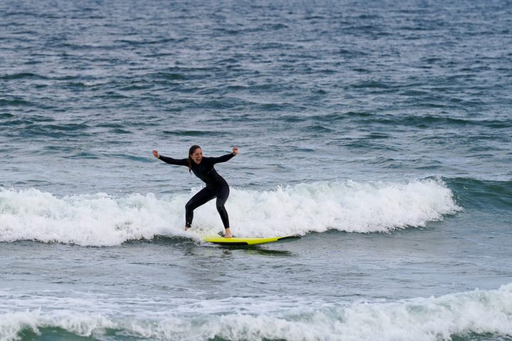 a man riding a wave on a surfboard in the ocean