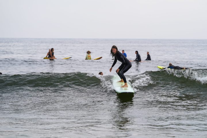 a man riding a wave on a surfboard in the water