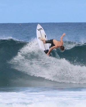 a man riding a wave on a surfboard in the ocean