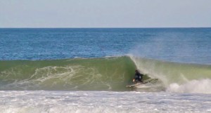a man riding a wave on a surfboard in the ocean