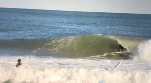 a person riding a wave on a surfboard in the ocean