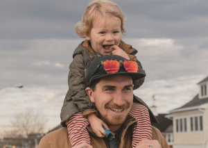 a little boy wearing a hat