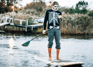a person riding a surf board on a body of water