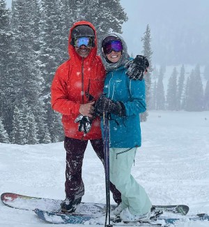 a person standing on a snow covered slope