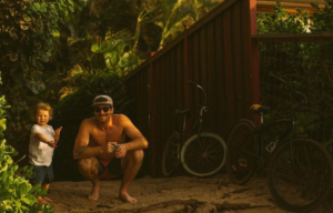 a man and a woman walking down a dirt road