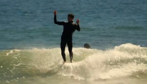 a man riding a wave on a surfboard in the ocean