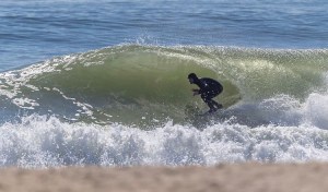 a person riding a wave on a surfboard in the ocean
