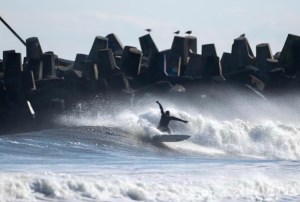 a group of people riding skis on top of a wave