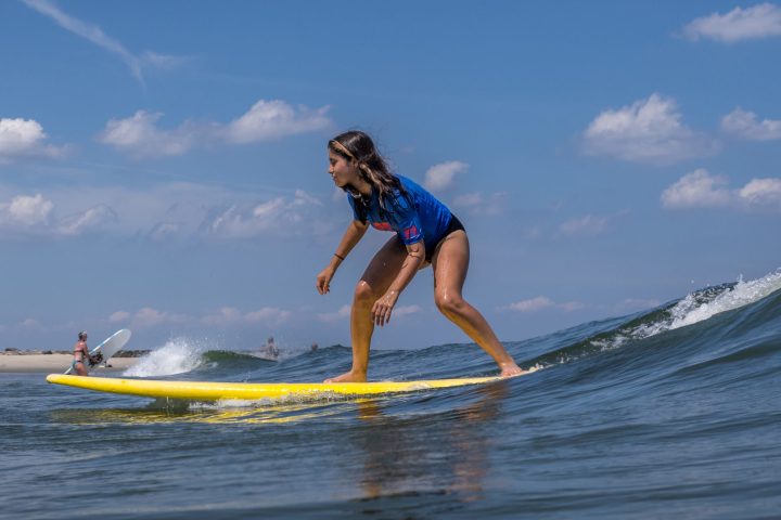 a man riding a wave on a surfboard in the water