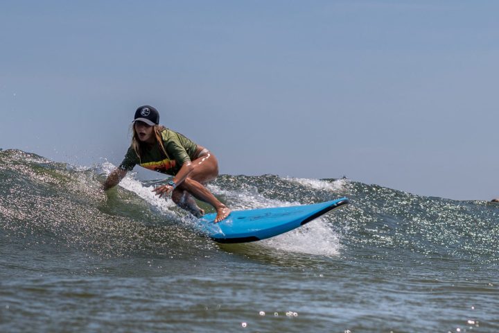a man riding a wave on top of a body of water
