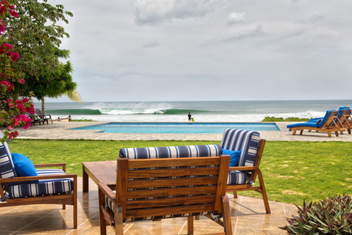 a couple of lawn chairs sitting on top of a wooden table