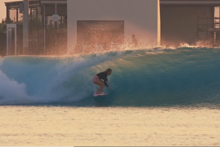 a man riding a wave on a surfboard in the water