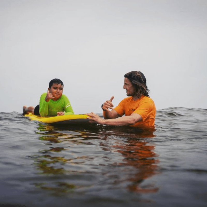 a man lying in a body of water